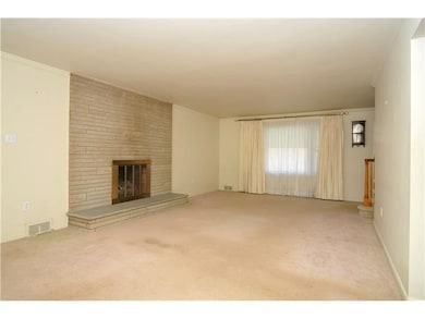 Living Room. There are hardwood floors under the c
