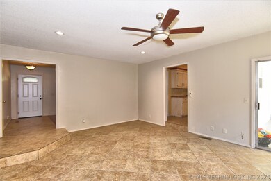 looking toward front door and kitchen