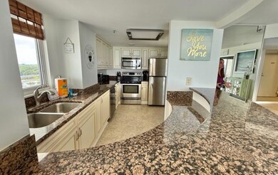 Kitchen with stainless steel appliances and cream cabinets