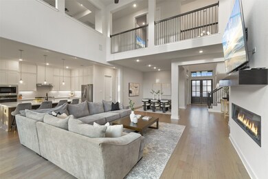 THE FAMILY ROOM OPENS UP TO THE GOURMET KITCHEN. N
