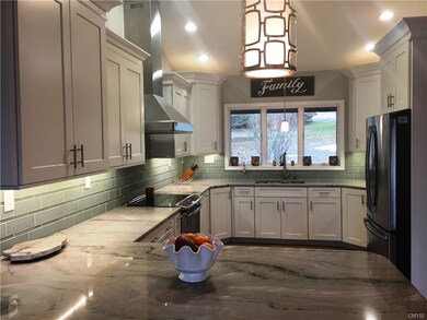 A picture window can be found at kitchen sink!