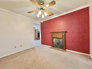 Unfurnished living room featuring ceiling fan, a t