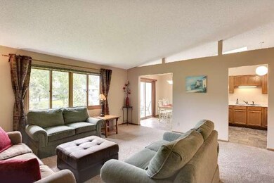The living room adjoins the kitchen and informal d