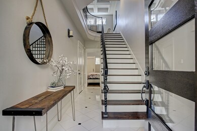 Front foyer greets you with soaring ceilings, gran