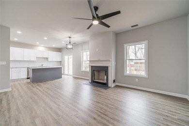 Spacious family room with view of dining room and kitchen.