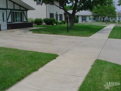 Newer oversize driveway, front entry area & public