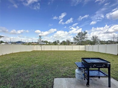 124 Bergamot Loop, Davenport, FL 33837 - photo 3