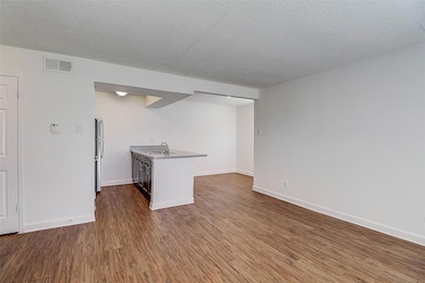 Kitchen featuring sink, hardwood / wood-style floo