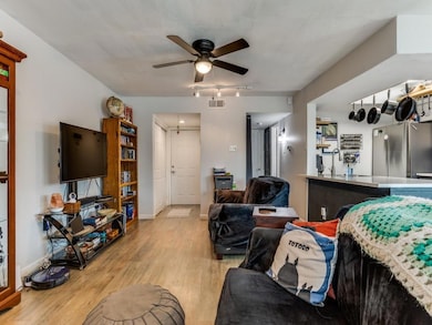 Living area featuring light wood-style flooring, v