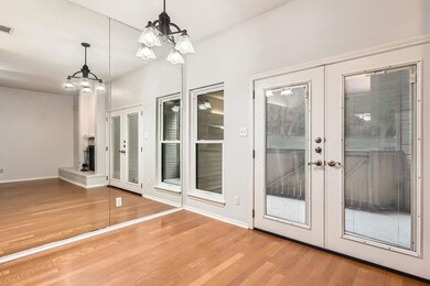 Doorway to outside with an inviting chandelier, f