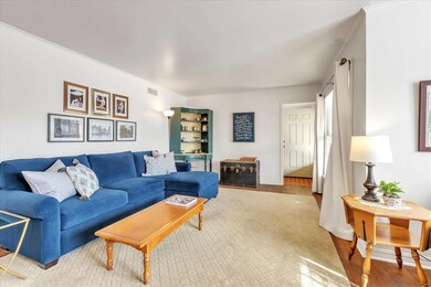 Living area featuring wood floors