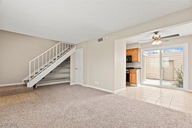 living room featuring light carpet, light tile pat