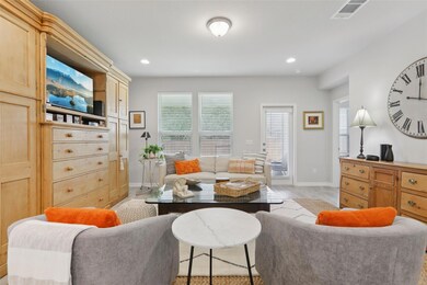 Living room with recessed lighting and light wood finished floors