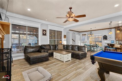 Family room featuring ceiling fan with notable cha