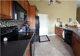GORGEOUS TILED BACK SPLASH AND BLACK APPLIANCES! 4