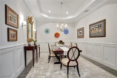 Dining or flex space with wide plank floors, crown