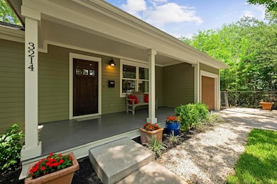 Entrance to property with a porch, driveway, and 