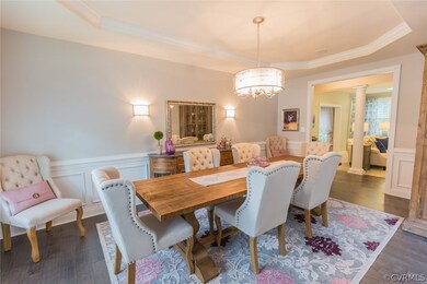 Dining room with tray ceiling, picture-frame wains