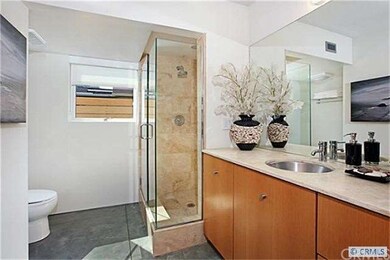 Across the hall from the guest bedroom is a full b