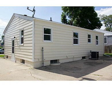 Exterior Back. New paint, windows and AC