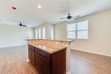 Kitchen featuring light stone countertops, ceiling