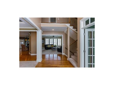 2-story entry and metal spindles on staircase with