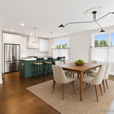 Dining area featuring dark wood-style flooring and
