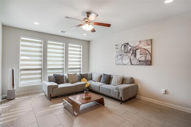 Living room featuring recessed lighting, baseboar