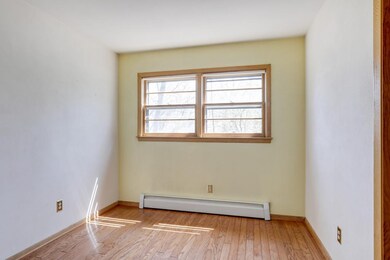 One of three main level bedrooms featuring hardwoo