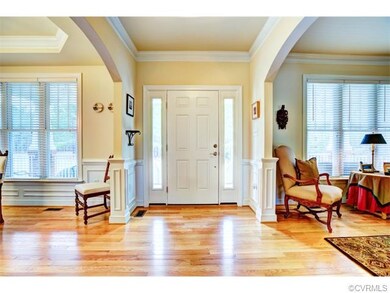 Bright Foyer with extensive moldings