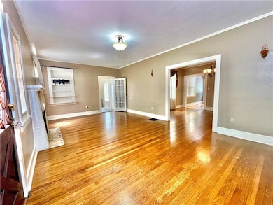 Unfurnished room featuring a notable chandelier, b