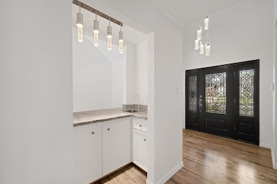 Check out the foyer with an amazing dry bar.