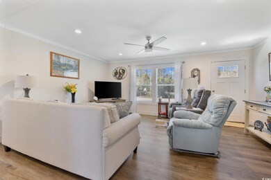 Living room with ornamental molding, recessed ligh