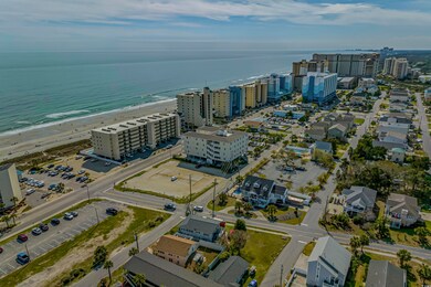 Bird's eye view with a view of the beach and a wat