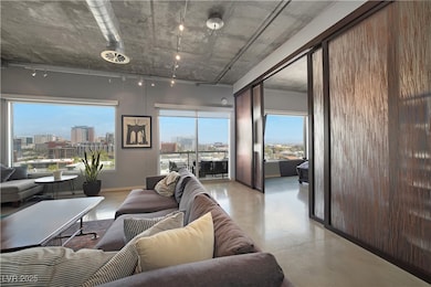 Living area with rail lighting, a city view, finis