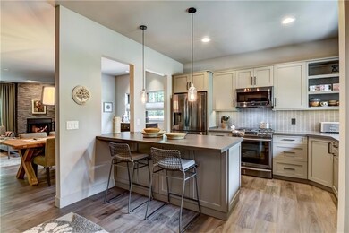 Sitting counter in the kitchen allow for conversations with guests as you cook in the kitchen with the upgrade appliances