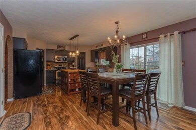 Spacious kitchen with large open eat-in area.