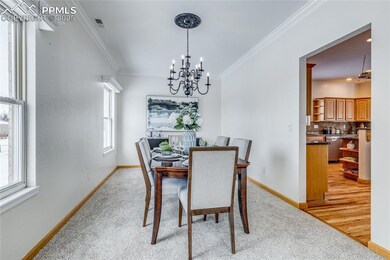 Dining room off the kitchen with new carpet, crown
