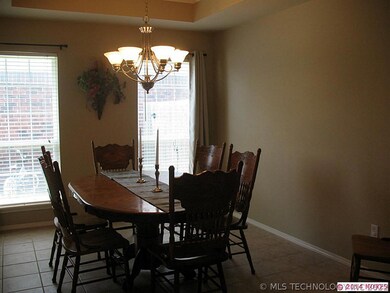Formal dinning with box ceiling and decorative lig