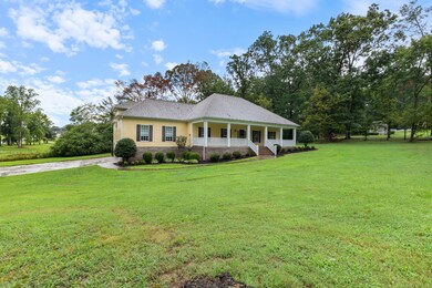 Professionally Manicured Landscaping can be enjoyed from your MASSIVE Covered Front Porch!