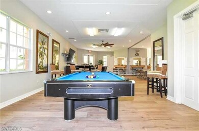 Recreation room with ceiling fan, light hardwood /