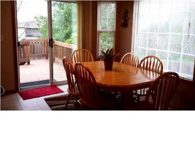 DINING AREA AND OUT TO THE SPACIOUS DECK & FENCED 