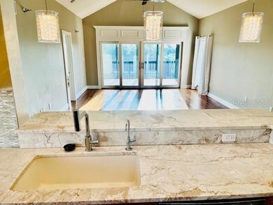 KITCHEN VIEW INTO LIVING RM