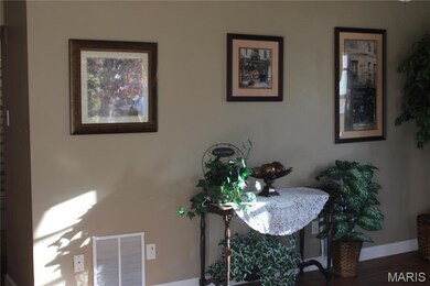 Dining area with wood finished floors and baseboards