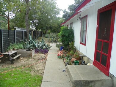 Fenced backyard featuring a vegetable garden
