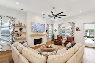 Living area, wood floors, crown molding, 11' ceili