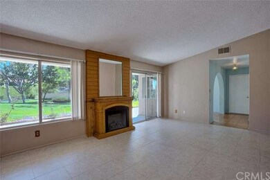 Living room has vaulted ceiling and great natural 