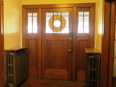 Entry/Foyer. The vintage door and sidelights are i