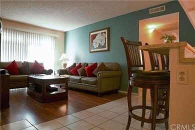 Living room with accent wall and slider window to 