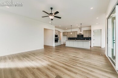 Unfurnished living room featuring light wood-style floors, recessed lighting, and a ceiling fan